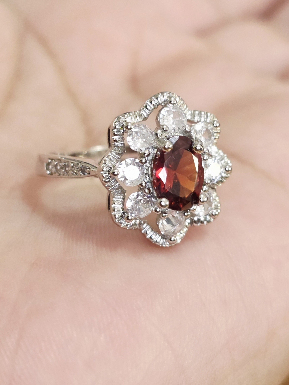 White Gold Plated Floral Halo Ring with Garnet Center